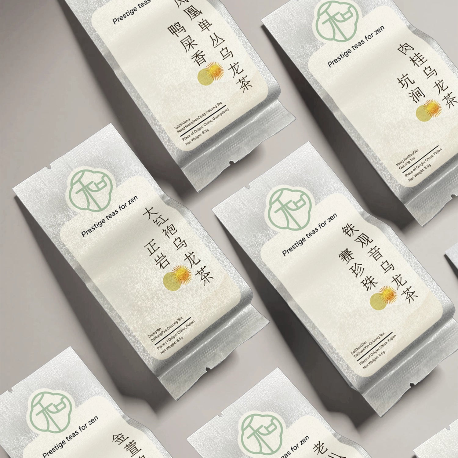 Collection of luxury Chinese loose oolong teas packaged in branded elegant packaging arranged across table